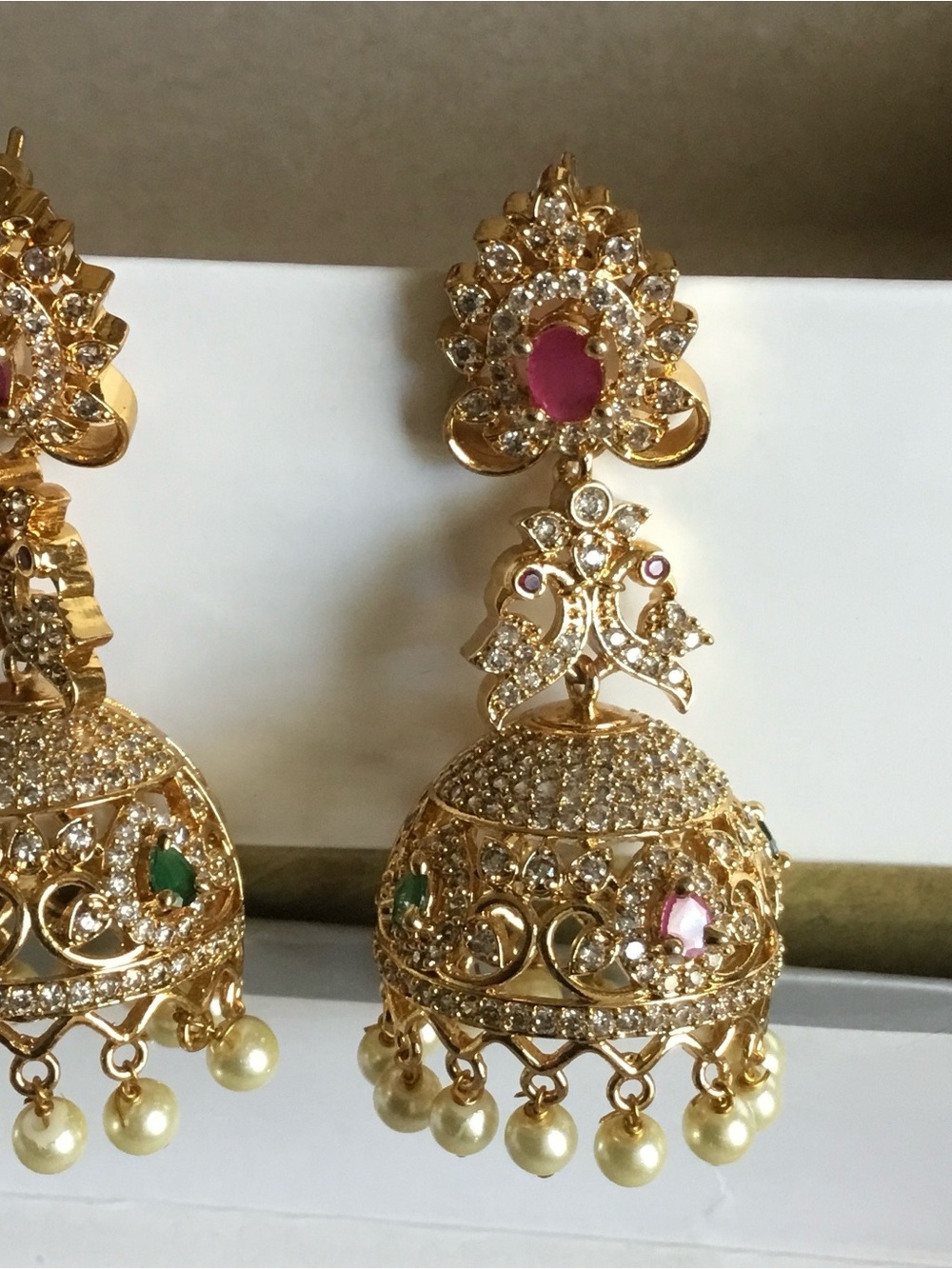 Gold Jhumka Earrings with Pink and Green Accents